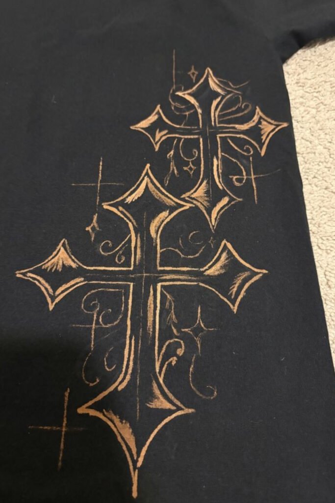 Black t-shirt with large bleached ornamental cross designs