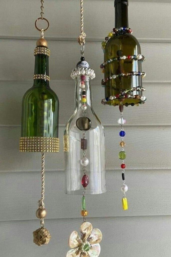 Wind chime made from repurposed glass bottles hanging outdoors