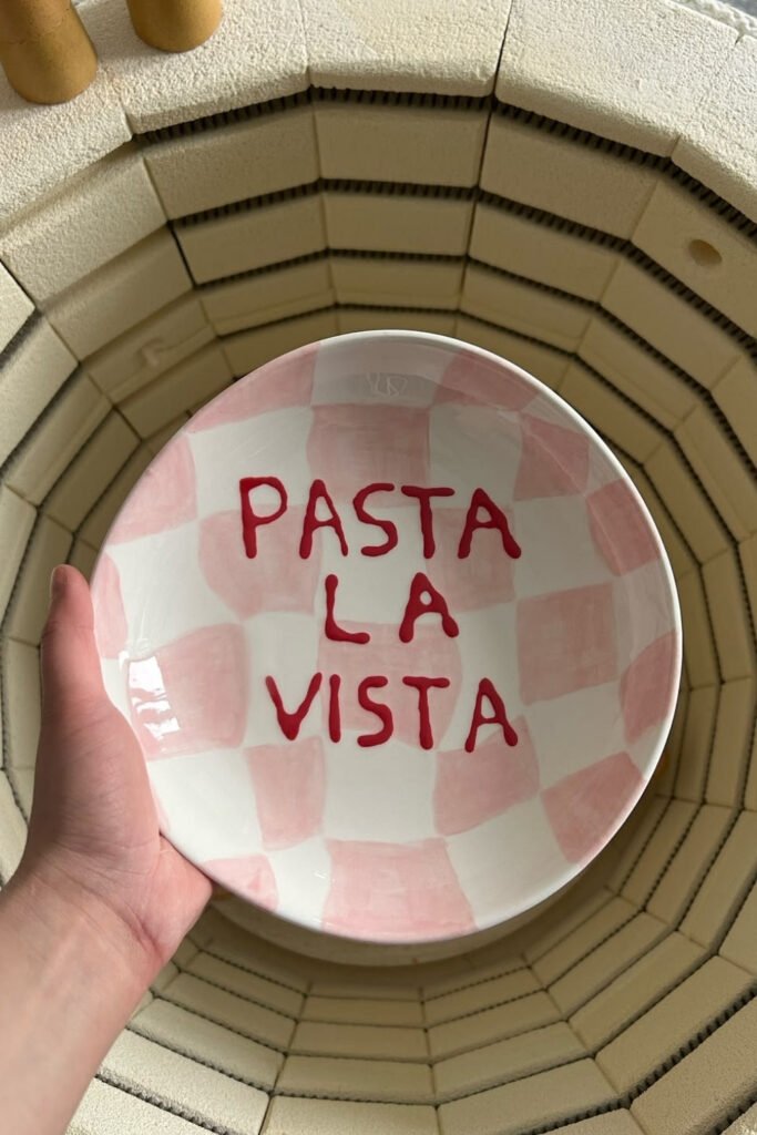 Pink checkered bowl with hand-lettered pasta text