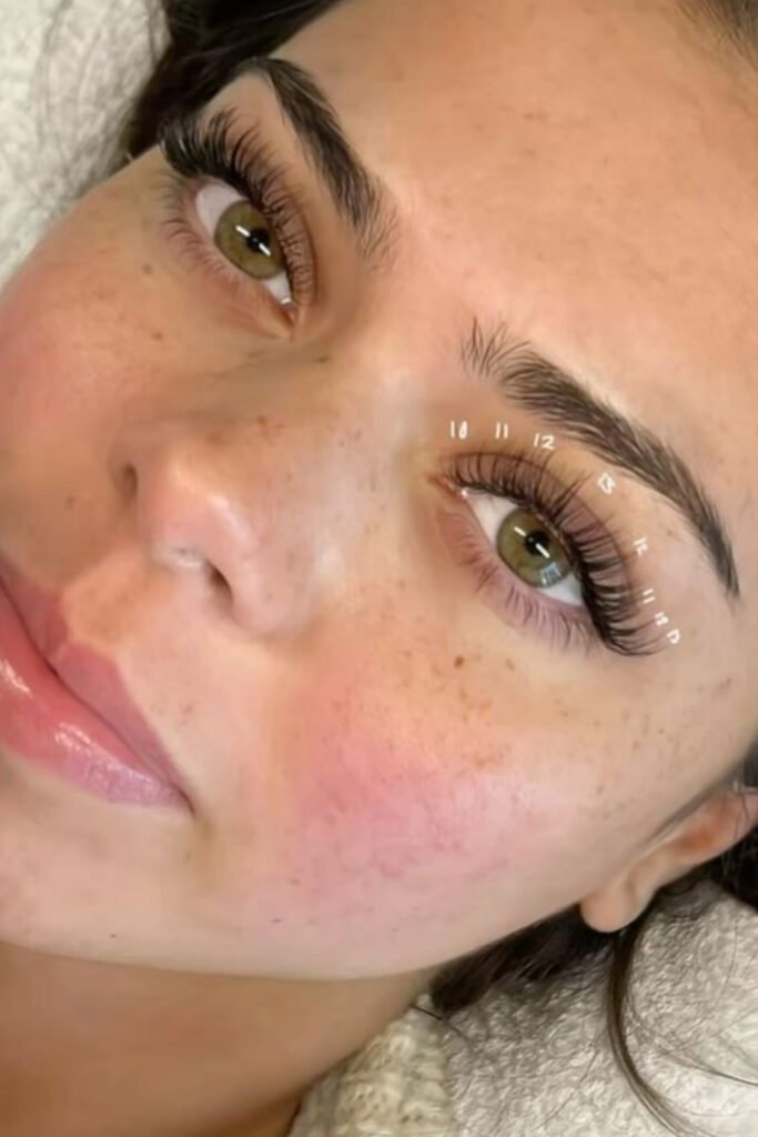 Side view of an eye with long, fluttery eyelash extensions