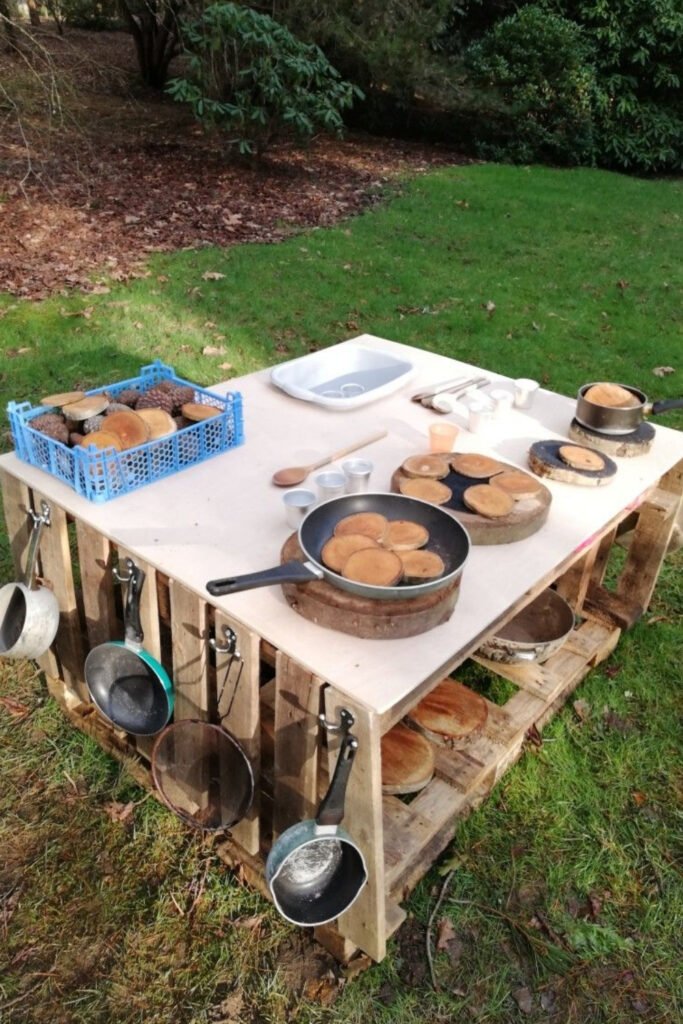 Pallet table mud kitchen with pots