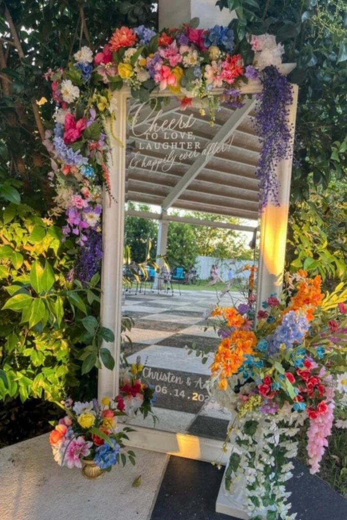 Garden gate covered in colorful wildflowers for a whimsical wedding