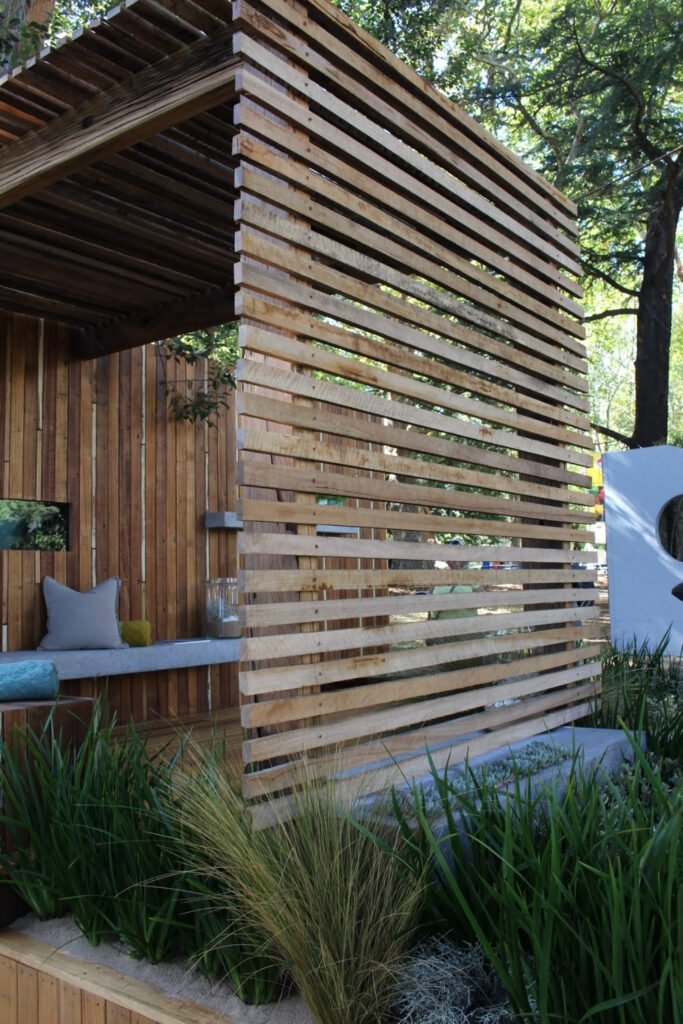Tall horizontal wood slat privacy wall