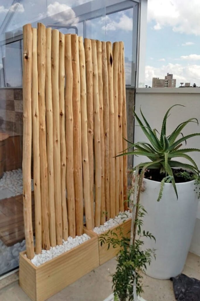Bamboo pole privacy screen in a planter