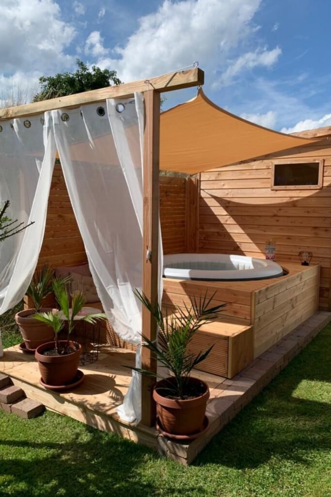 Outdoor cabana with sheer white curtains
